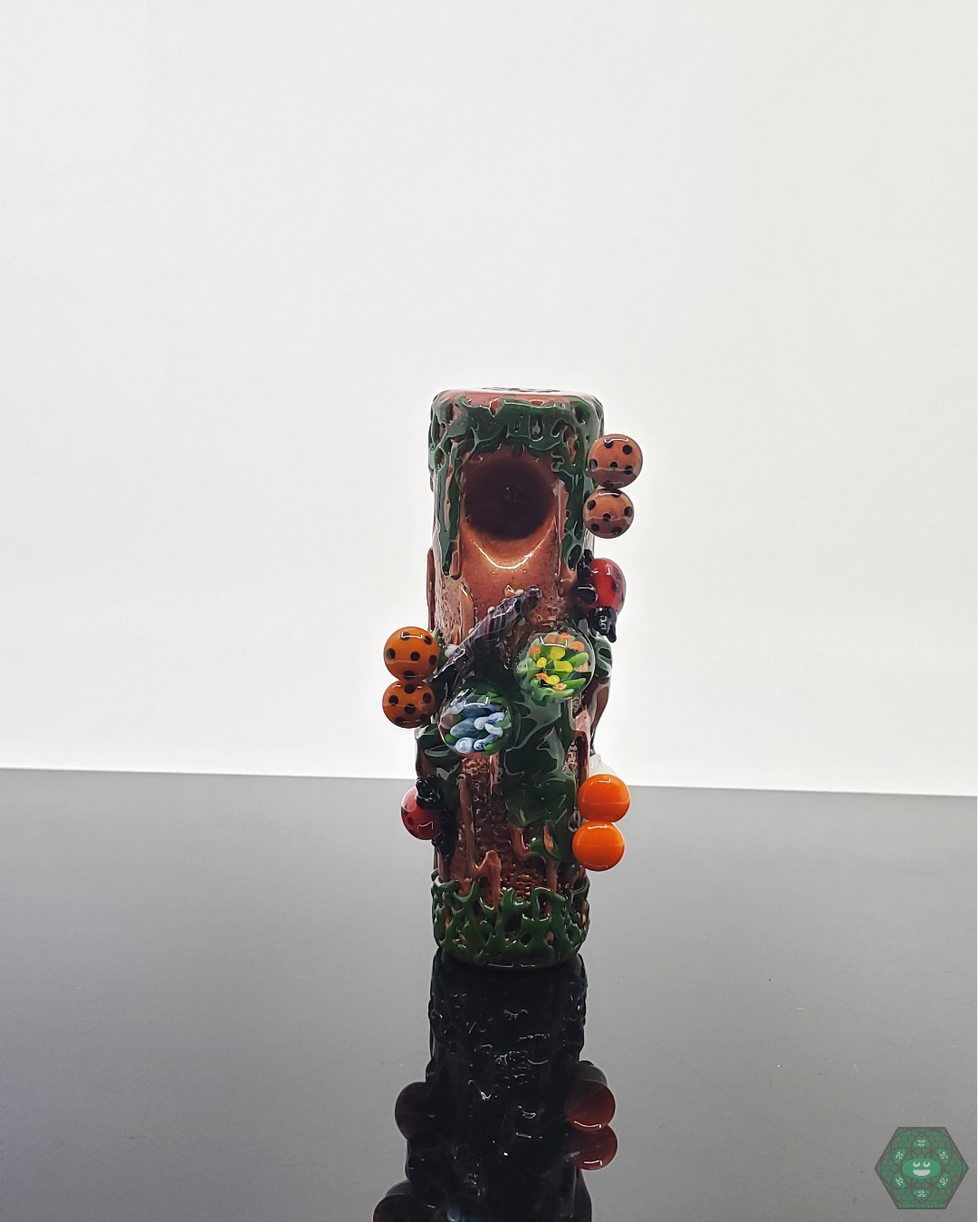  Close-up of the Empire Glassworks Mossy Log Dry Pipe, showcasing handcrafted details and artistic glasswork.