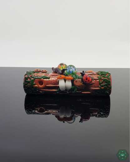  Empire Glassworks Mossy Log Dry Pipe featuring intricate sculpted critters and natural textures for a unique smoking experience.