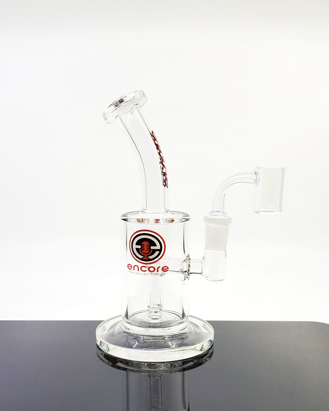 Encore Glass 7” Clear Downstem in its storage jar, designed to provide compact filtration and smooth performance for everyday use.