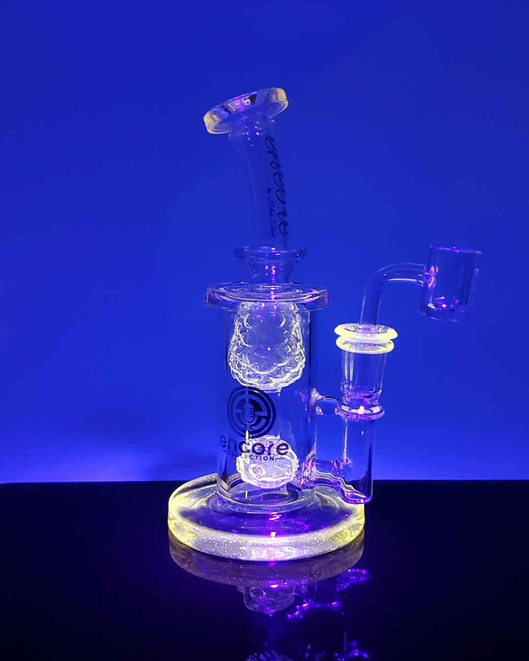 Side view of the Encore Glass 7.5” UV Pineapple Incycler, featuring a vibrant UV-reactive pineapple design for smooth, filtered hits.
