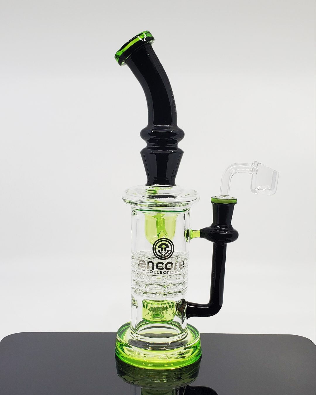Encore Glass 9” Gothic Ratchet Recycler featuring an intricate design and advanced filtration for smooth hits.