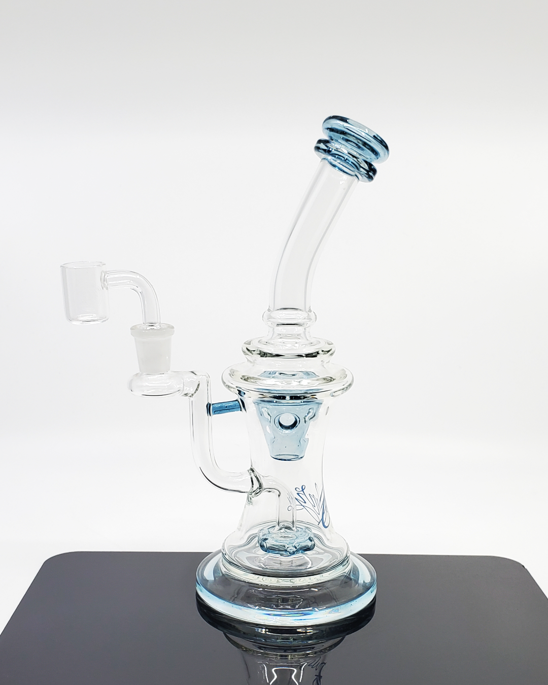  Side view of the Envy Glass Studios 10" UFO Swiss Perc Bong, highlighting its Swiss perc for efficient filtration and sleek, compact design for portability and style.