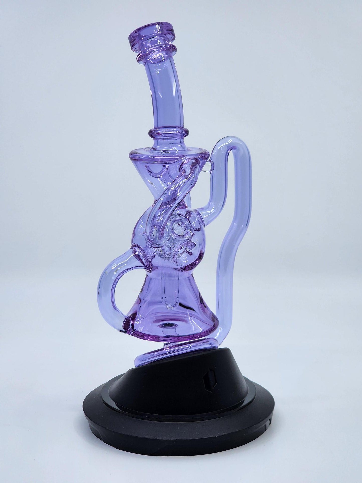 Close-up of the 5-hole disk perc in the Exo Recycler Puffco Attachment, optimizing airflow and vapor cooling.