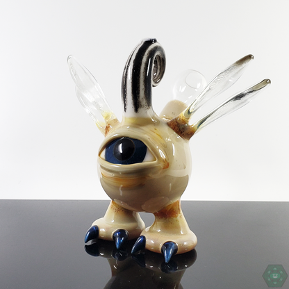  Close-up of the Gemini Andy Flying Eye Pendant, highlighting the detailed craftsmanship and artistic elements.

