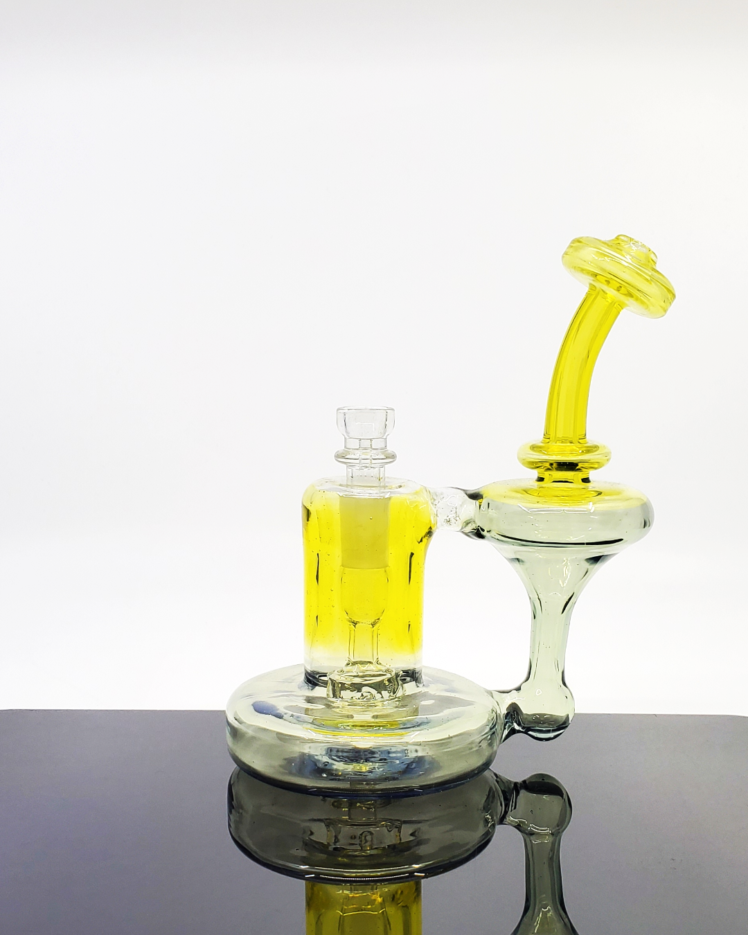 Glass Tribe CFL Bell Recycler Dab Rig with an innovative design, offering smooth hits and vibrant CFL color shifts under different lighting