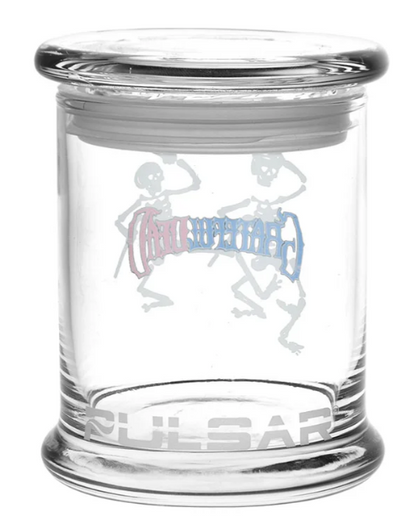 Grateful Dead x Pulsar Pop Top Jar with Top Hat Skeletons – Unique 4.5-inch glass jar with airtight pop-top lid, designed with psychedelic skeleton art for secure and stylish herb storage.