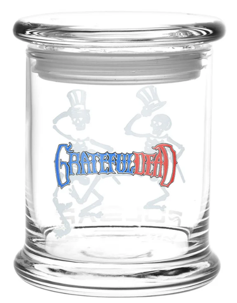 Grateful Dead x Pulsar Pop Top Jar – 4.5-inch glass herb storage jar with Top Hat Skeletons design. Airtight seal and pop-top lid to keep herbs fresh, featuring iconic skeleton artwork from the band’s 1977 album cover.