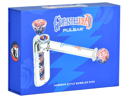 Grateful Dead x Pulsar Wig Wag Hammer Bubbler – 4-inch glass bubbler with Stealie herb slide and etched dancing skeleton. Includes luxury padded box and is perfect for collectors and fans of Grateful Dead memorabilia.

