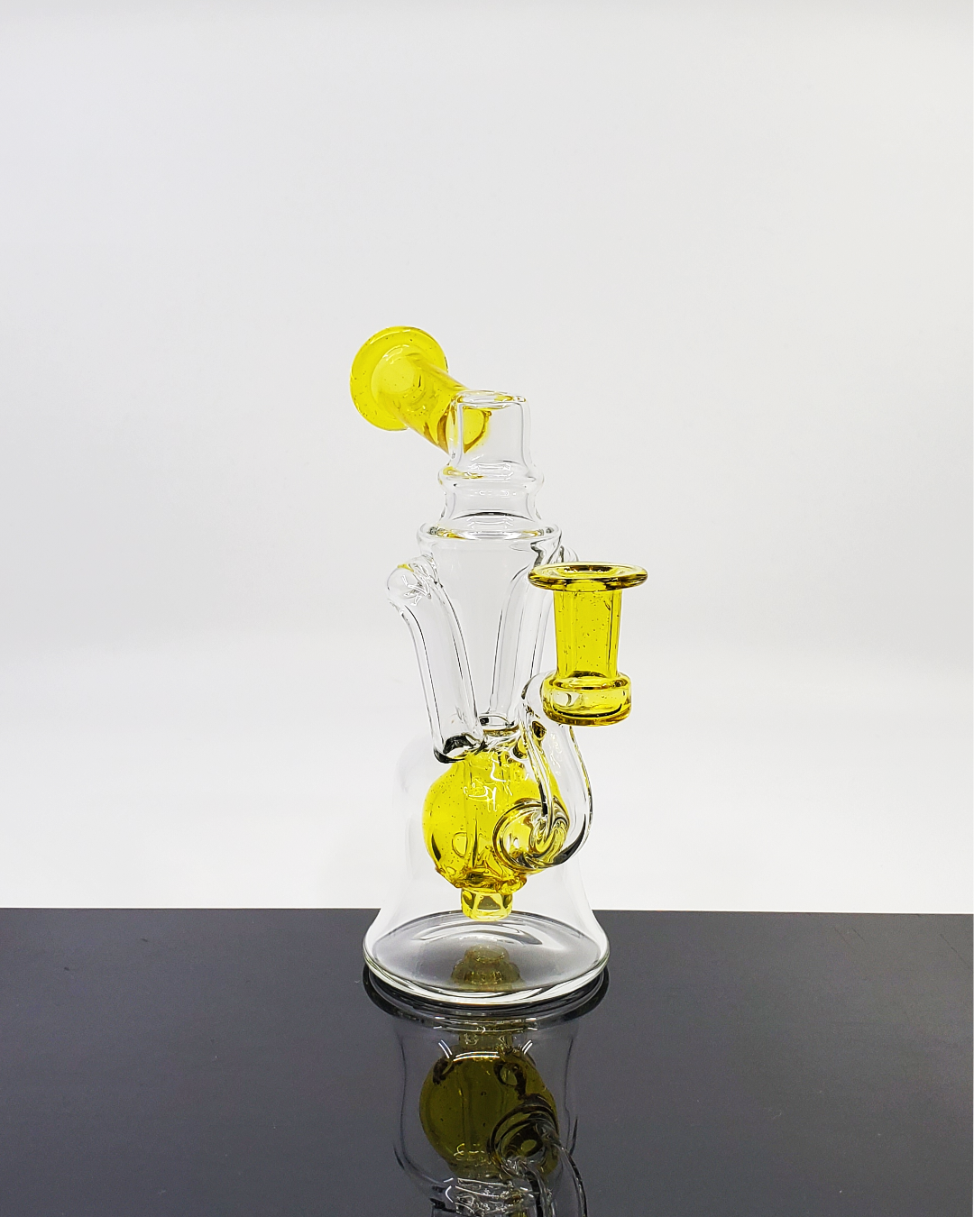 Greybo Glass Ball Cycler with color accents, featuring integrated filtration for smooth draws. A stylish and functional glass piece with authenticity details.