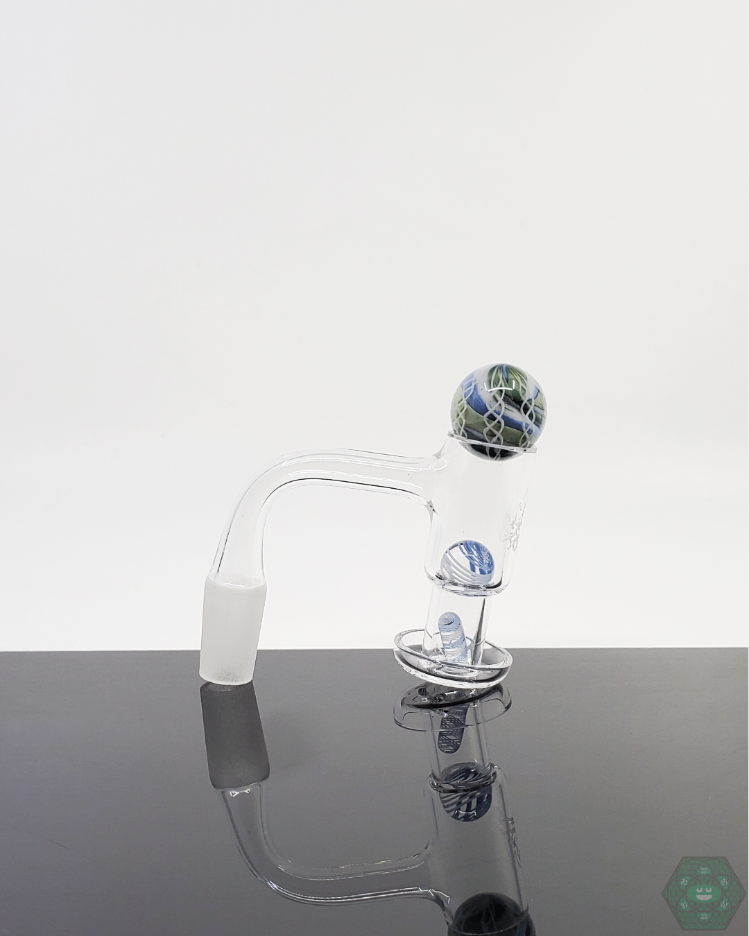 Artistic Harold Cooney Glass Slurper Set with detailed design, terp pearls, and marble for optimal quartz nail dabbing.