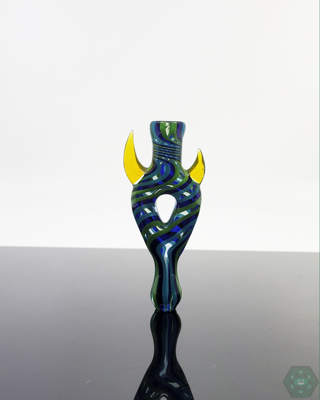 Shop Jon E Walker’s Donut Chillum, crafted with a unique design for a functional glass piece that enhances your smoking sessions