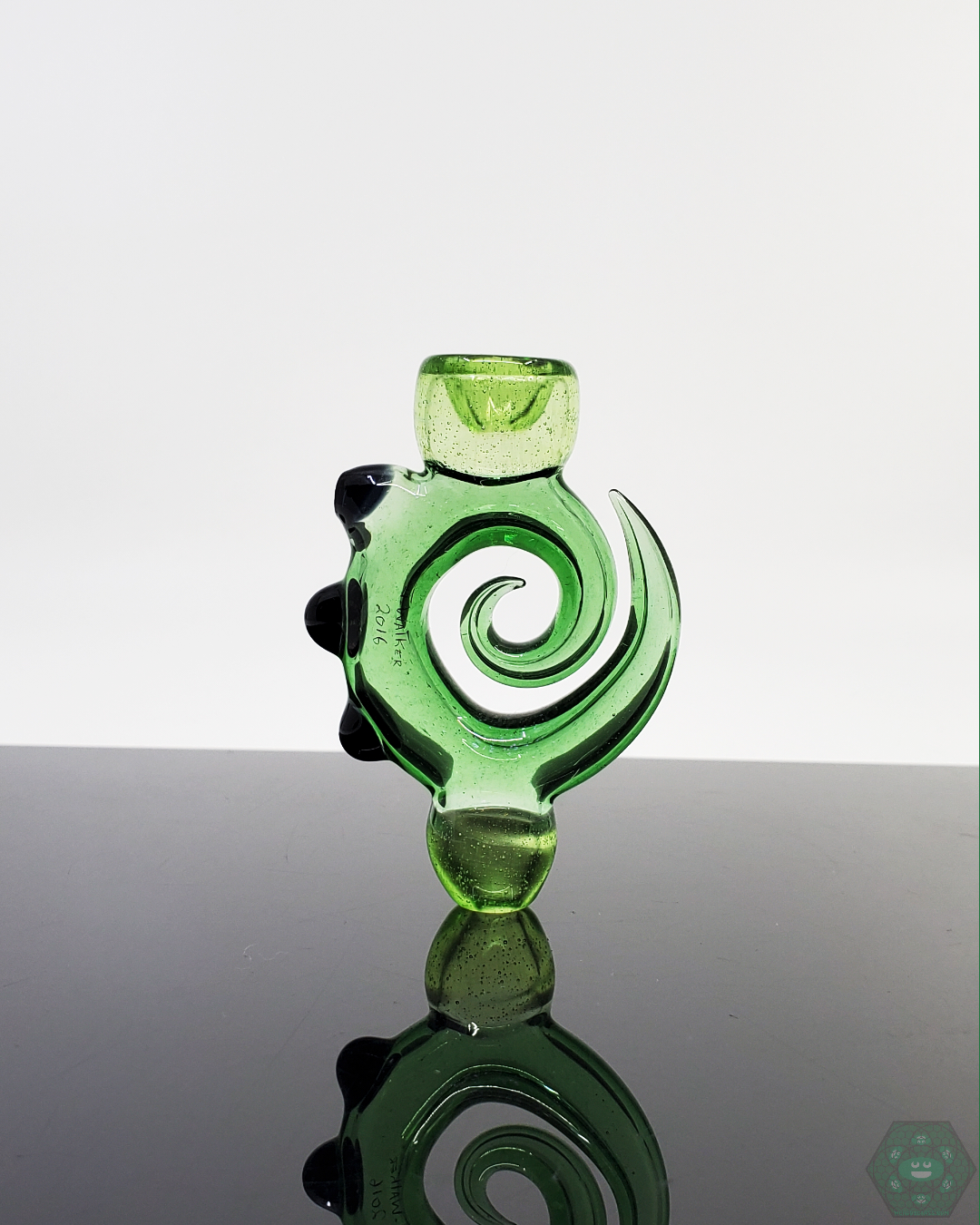 Jon E Walker Spiral Onie, a 3.5-inch handcrafted chillum featuring a unique Green dichroic twist design for compact and stylish smoking