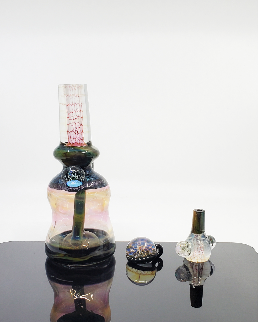  Close-up of the Kenan Tiemeyer Mini Tube with dichroic accents and an opal moon, adding a stunning visual touch.