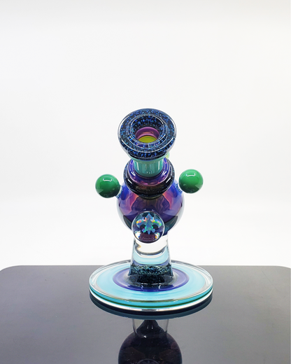 Limited Edition Heady Glass Rig: The Cajun Glass Two-Tone Crushed Opal Heliosphere is a collector's item, featuring eye-catching opal accents, a unique two-tone finish, and a functional 14mm joint.