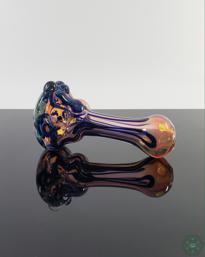 Bottom view of the LQL Glass Fumed Linework Spoon, emphasizing its durable construction and artistic details.