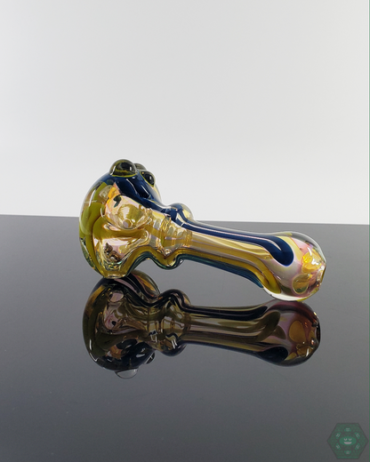  Close-up of the LQL Glass Fumed Linework Spoon, highlighting the intricate linework and evolving color effects.
