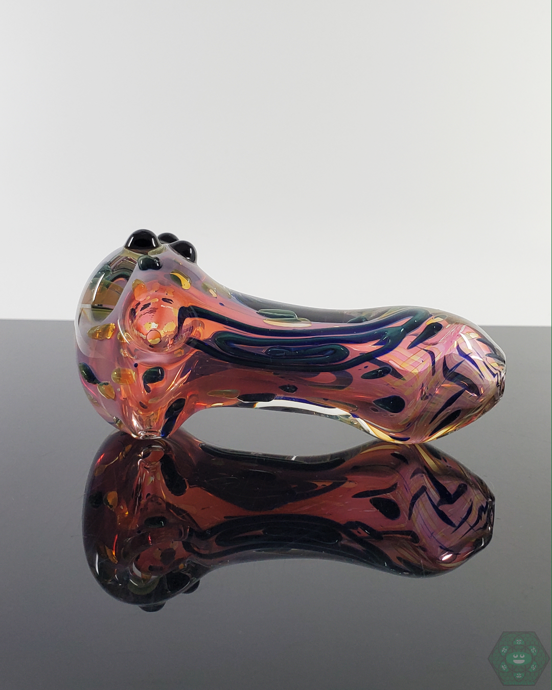  LQL Glass Fumed Linework Spoon held in hand, demonstrating its comfortable grip and high-quality glasswork.