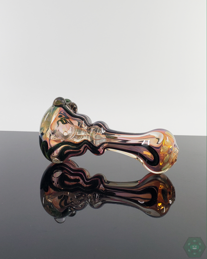 Side view of the LQL Glass Fumed Linework Spoon, showcasing its detailed fumed glass patterns and smooth contours.