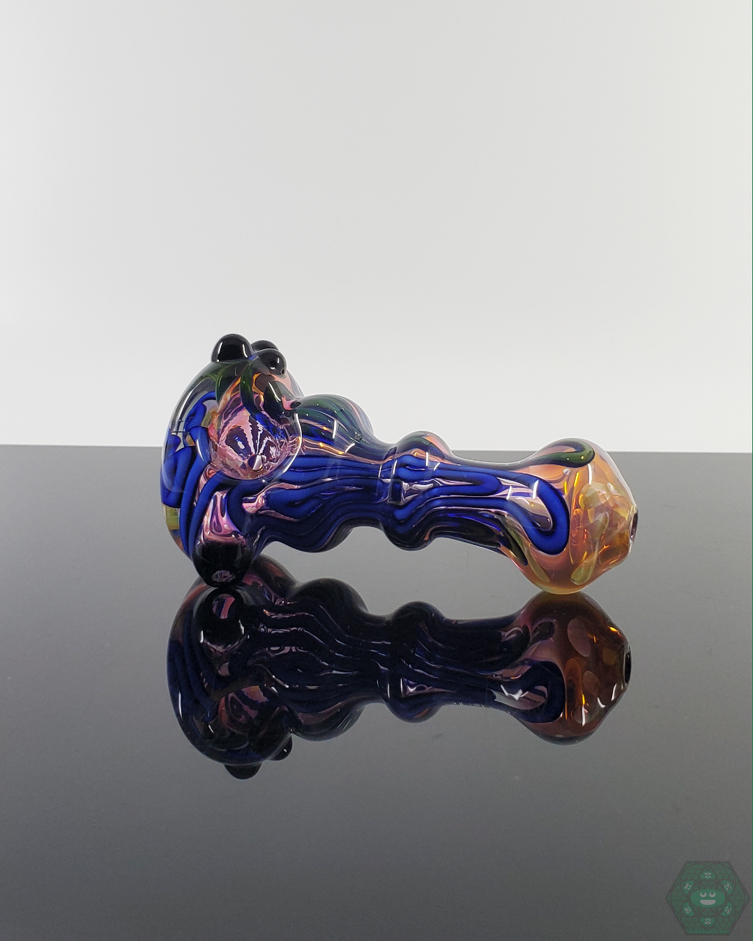 Top view of the LQL Glass Fumed Linework Spoon, displaying its precision craftsmanship and balanced airflow.