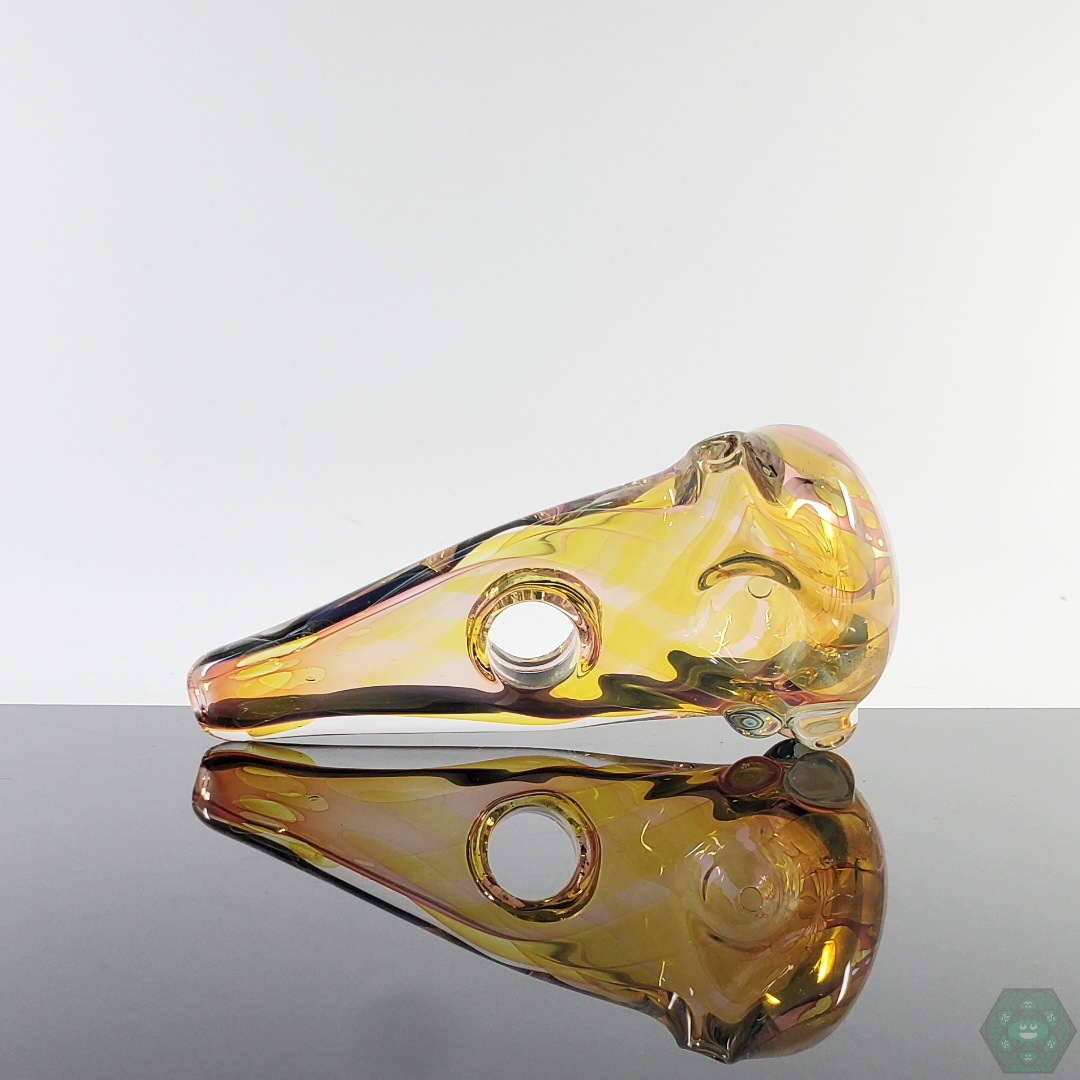 Bottom view of the LQL Glass Fumed Multi-Section Spoon, emphasizing its sturdy glass construction and balanced shape.