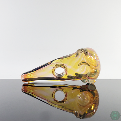 Bottom view of the LQL Glass Fumed Multi-Section Spoon, emphasizing its sturdy glass construction and balanced shape.