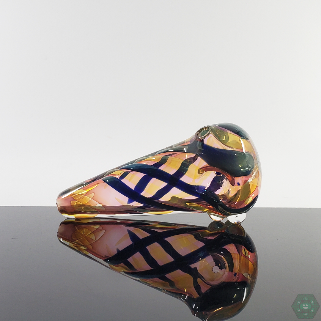 LQL Glass Fumed Multi-Section Spoon held in hand, demonstrating its comfortable size and elegant design.