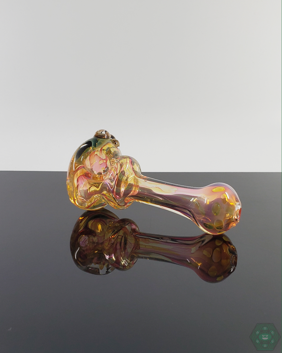 Bottom view of the LQL Glass Fumed Spoon, showing its durable construction and left-side carb placement.