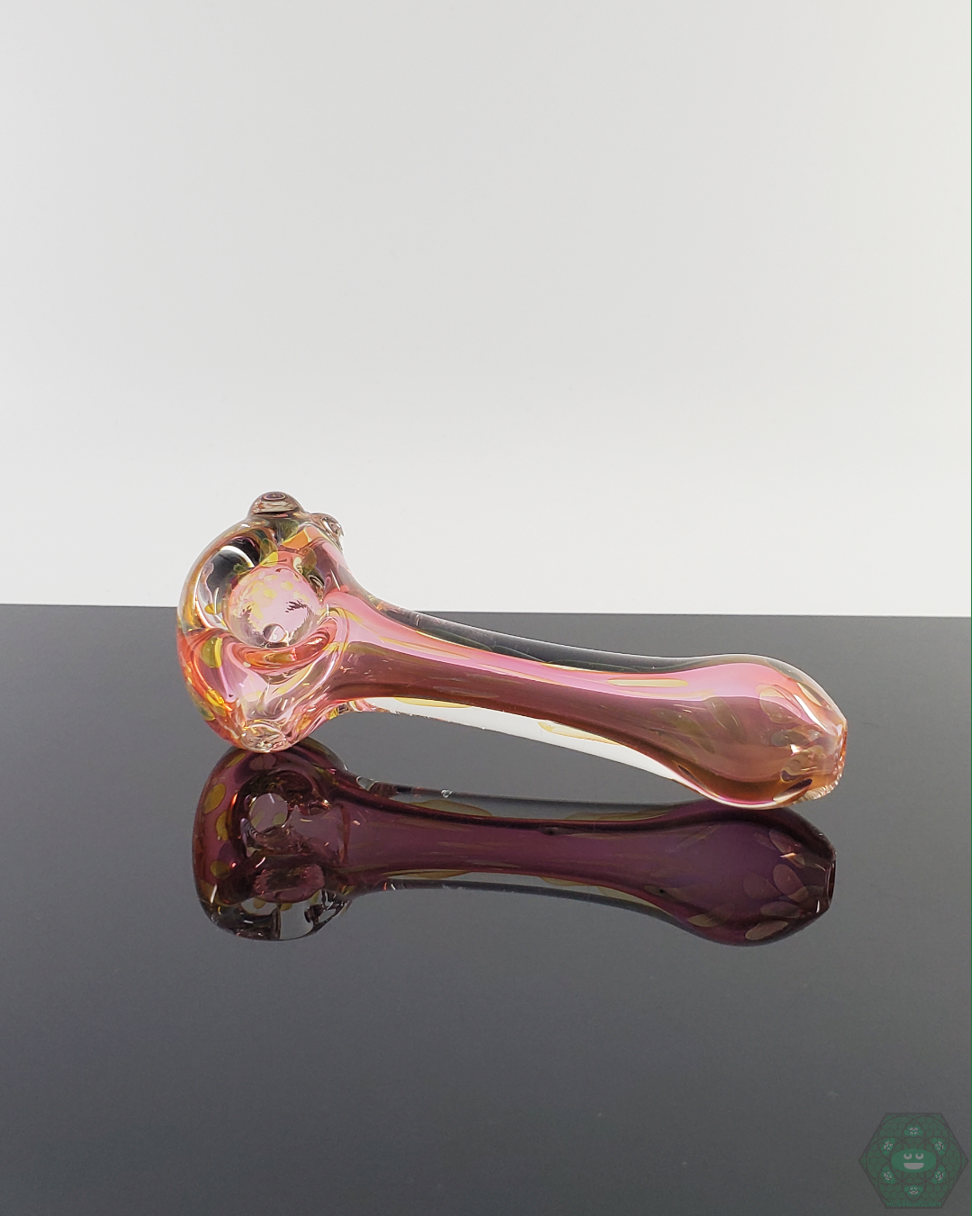  LQL Glass Fumed Spoon held in hand, demonstrating its compact 4.25-4.75” size and comfortable grip.