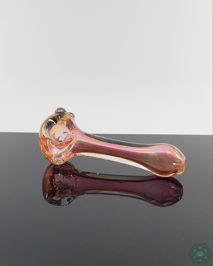  LQL Glass Fumed Spoon held in hand, demonstrating its compact 4.25-4.75” size and comfortable grip.