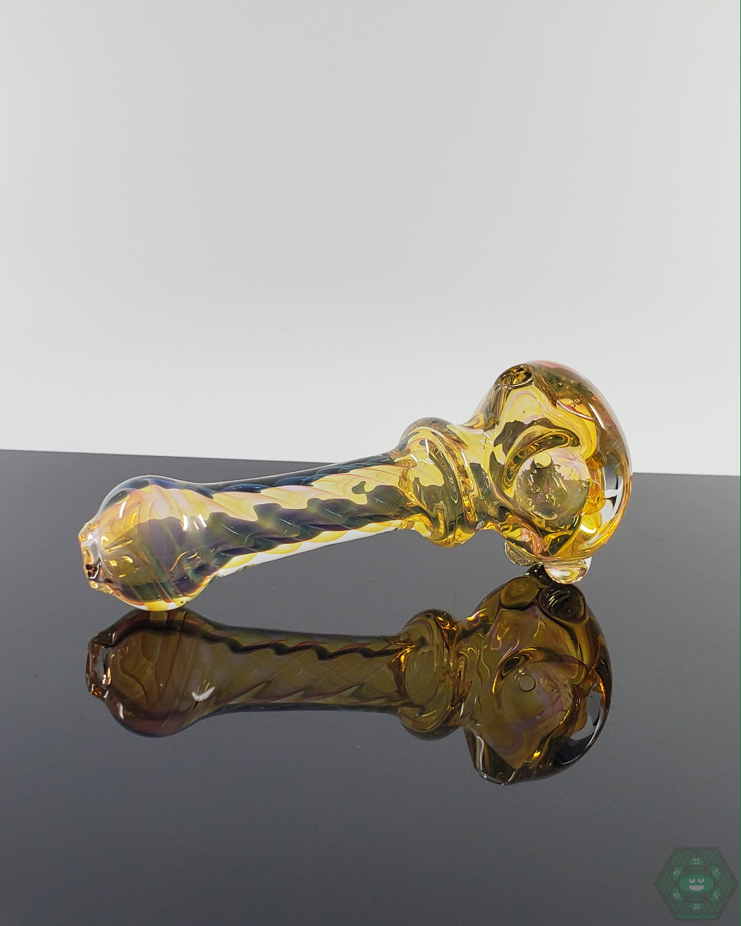 Top-down view of the LQL Glass Fumed Spoon, emphasizing its smooth contours and artistic craftsmanship.
