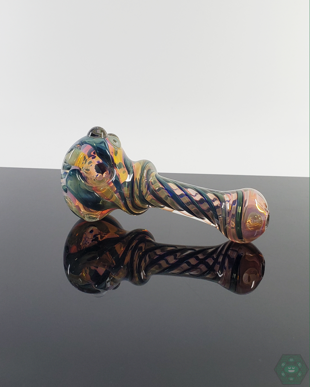  LQL Glass Triple Tornado Spoon featuring intricate fumed glass with swirling patterns and a color-shifting effect.