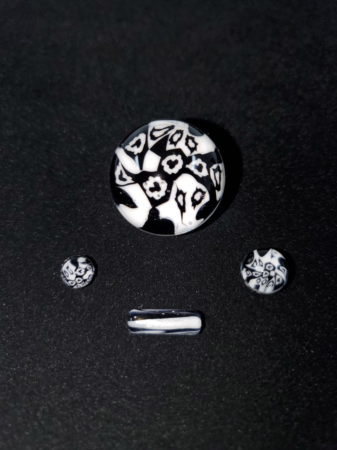 Close-up of the terp slurper marble in the Millennium Glass Slurper Set, emphasizing its vibrant design and functionality for enhanced dabbing.