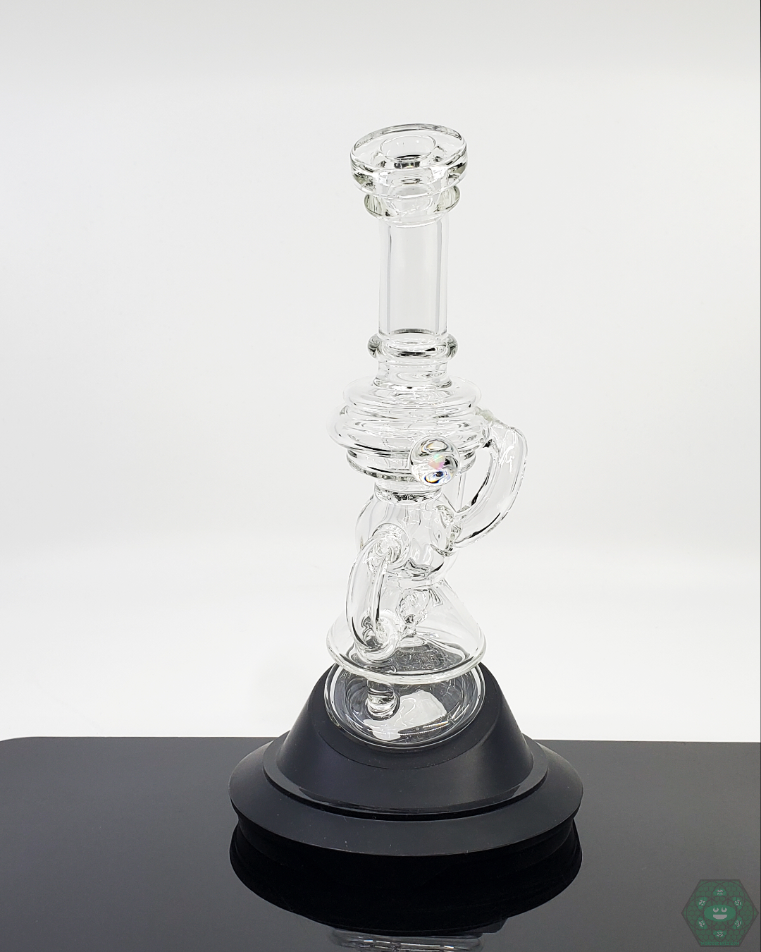 Using the Mini Recycler attachment on a Puffco, showing its effective water filtration in a compact form.