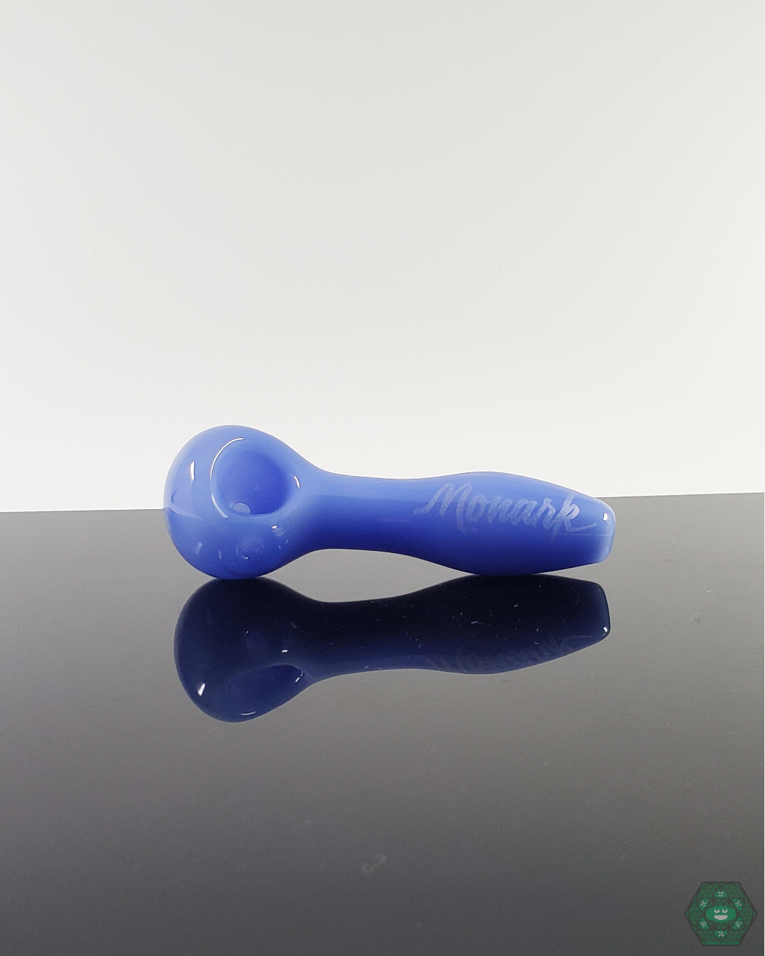 Close-up of the Monark Glass 4” Spoon Pipe, showcasing its comfortable grip and high-quality craftsmanship.