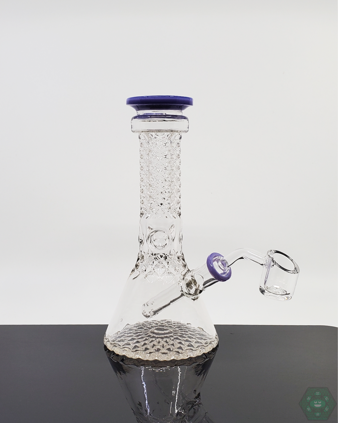 Monark Glass 7.25” Engraved Beaker, an elegant and functional glass piece designed for smooth hits and detailed craftsmanship.
