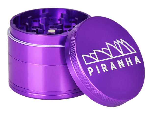  Piranha 2.2" 4-Piece Anodized Grinder, compact and efficient with a pollen chamber, sifting screen, and easy-to-grip friction ring.
