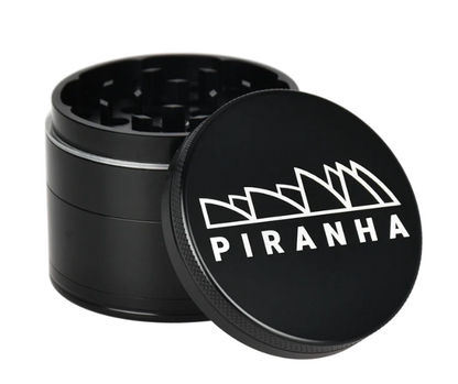 Piranha 2.2" 4-Piece Grinder, perfect for grinding herbs with a magnetic closure, sifting screen, and convenient canvas carry pouch.