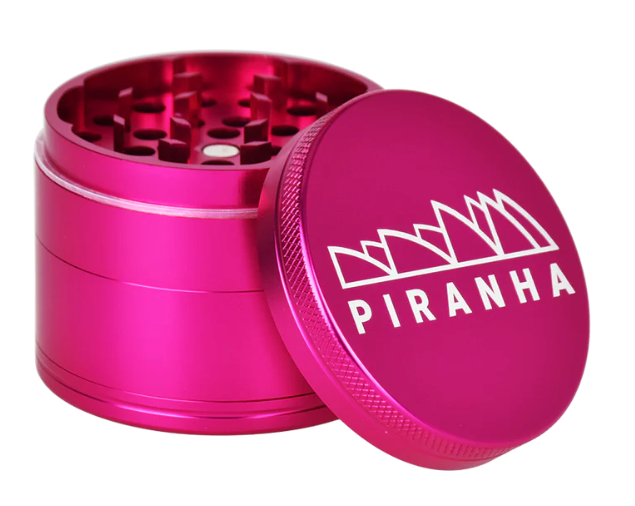  Piranha 2.2" 4-Piece Grinder with herb storage compartment, pollen chamber, and magnetic closure for a smooth grinding experience.