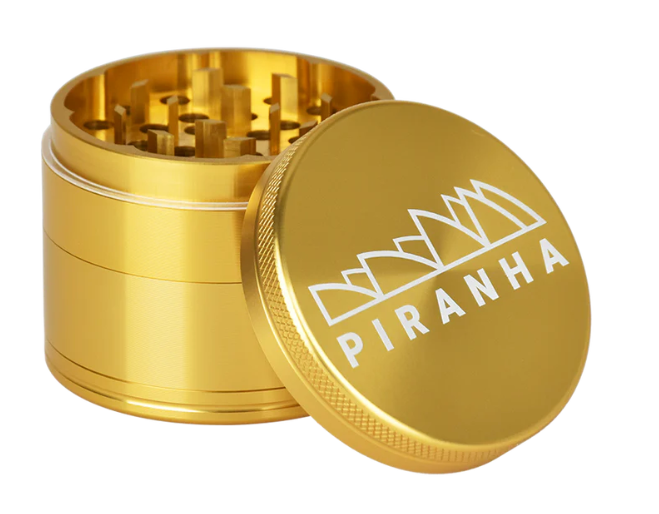 Piranha 2.2" 4-Piece Grinder, featuring a sifting screen and razor-sharp teeth, ideal for achieving perfect shredded herb consistency.