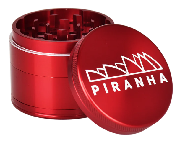 Piranha 2.2" 4-Piece Herb Grinder, designed with a canvas carry pouch and scraping tool for easy on-the-go use.