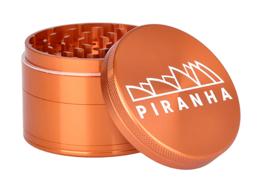 Piranha 2.5" 4-Piece Grinder, ideal for shredding herbs with a magnetic closure, sifting screen, and convenient pollen chamber.
