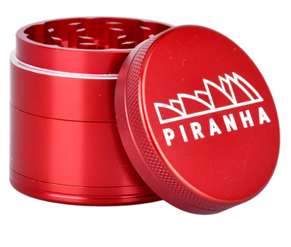 Piranha 2" 4-Piece Grinder with magnetic closure, pollen chamber, and razor-sharp teeth, perfect for efficient herb grinding and storage.