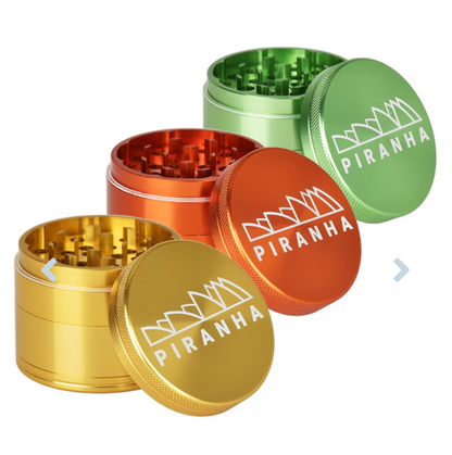 Piranha 4-Piece 2.2" Grinder, crafted from anodized aluminum with razor-sharp teeth, pollen chamber, and magnetic closure for smooth herb grinding.