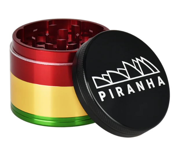 Piranha 4-Piece 2.2" Grinder with razor-sharp geometric teeth, magnetic closure, and sifting screen for high-quality herb grinding.