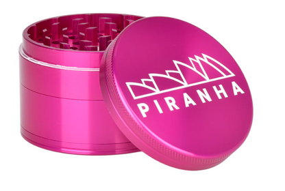 Piranha 4-Piece 2.5" Grinder, made from high-quality anodized aluminum, featuring a magnetic closure and sifting screen for clean results.