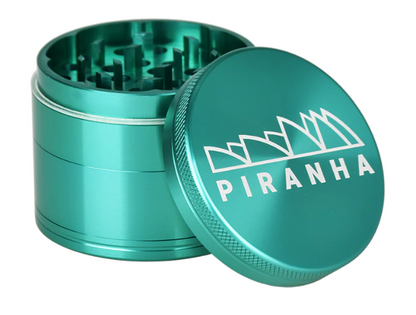  Piranha 4-Piece Grinder, 2.2" in diameter, featuring a pollen chamber, sifting screen, and magnetic closure for efficient grinding.