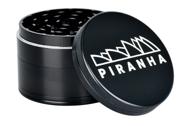 Piranha 4-Piece Grinder Set, 2.5 inches wide, with razor-sharp geometric teeth, magnetic closure, and a pollen chamber for efficient use
