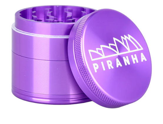 Piranha 4-Piece Grinder, 2-inch anodized aluminum with magnetic closure, built for efficient herb grinding and pollen collection.