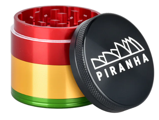 iranha Aluminum 4-Piece Grinder, 2" in diameter, featuring razor-sharp teeth and a pollen chamber for smooth herb grinding.