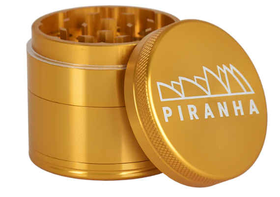 Piranha 2" 4-Piece Herb Grinder with sifting screen, designed for efficient grinding and enhanced storage for pollen.